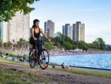 A woman cycles in Stanley Park