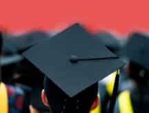 A graduate at their university graduation in ceremonial garb.